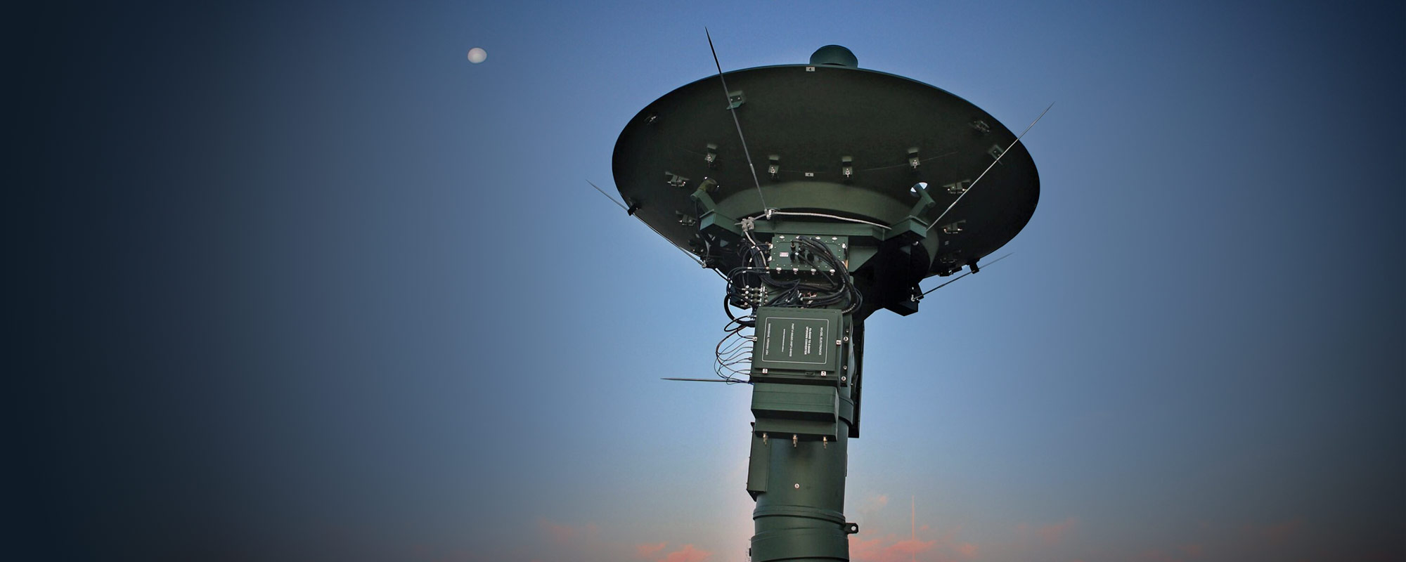 ground systems radar platform with moon in sky