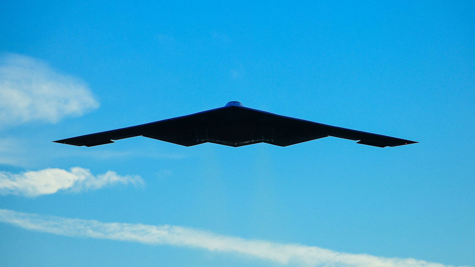 b-2-spirit-stealth-bomber_0011 B2 bomber flying amongst clouds on blue skies