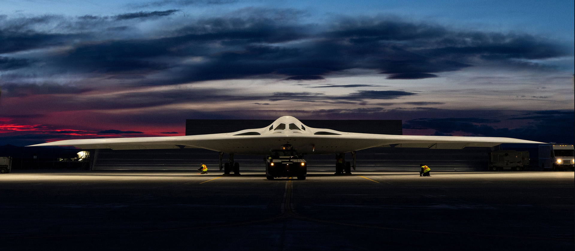B-21 on tarmac at night