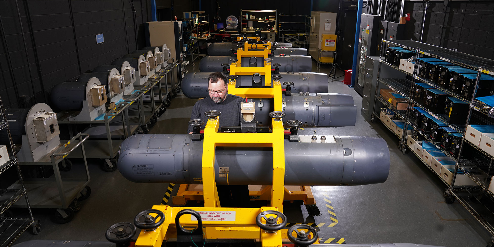 employee working in defense technology manufacturing facility