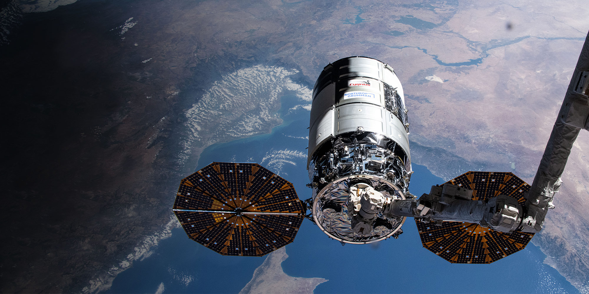 Cygnus spacecraft above Earth
