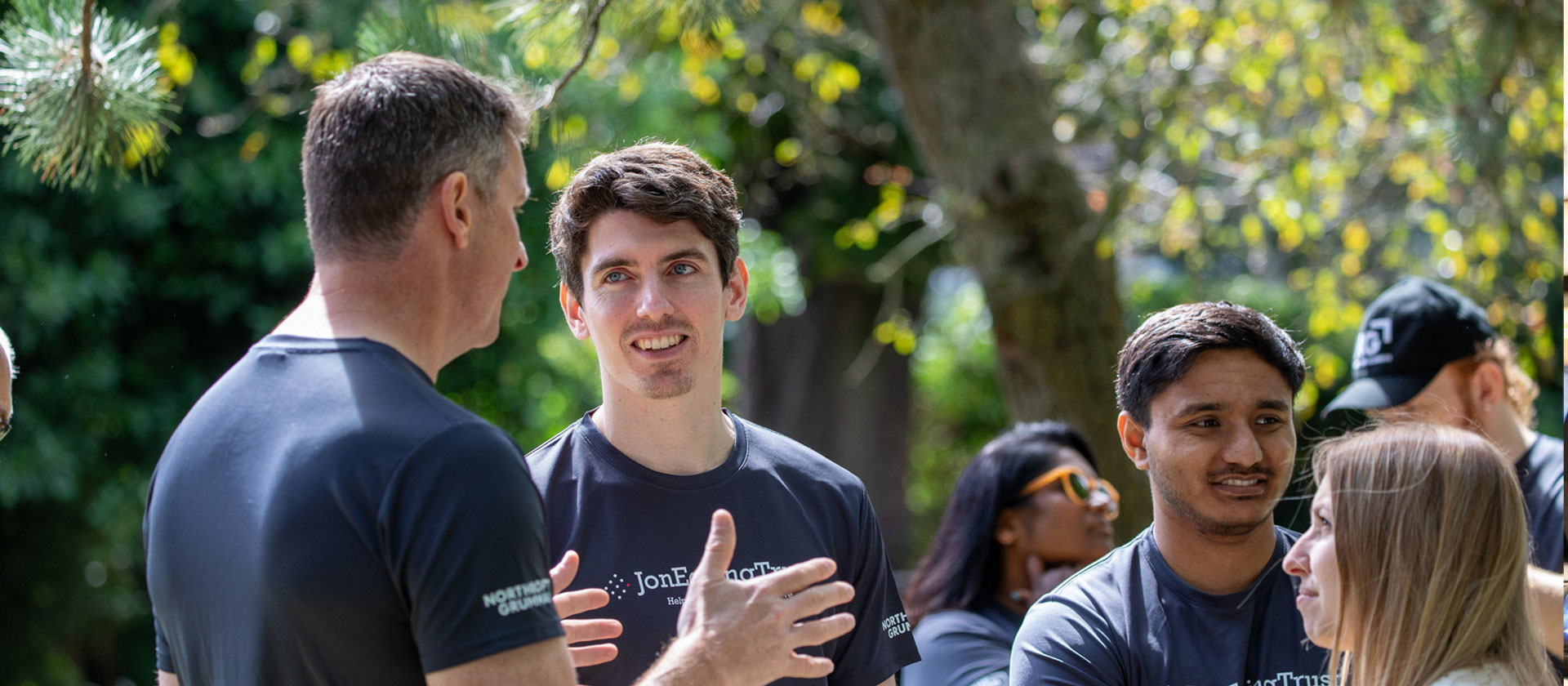 Image of people visiting at outdoor company event.