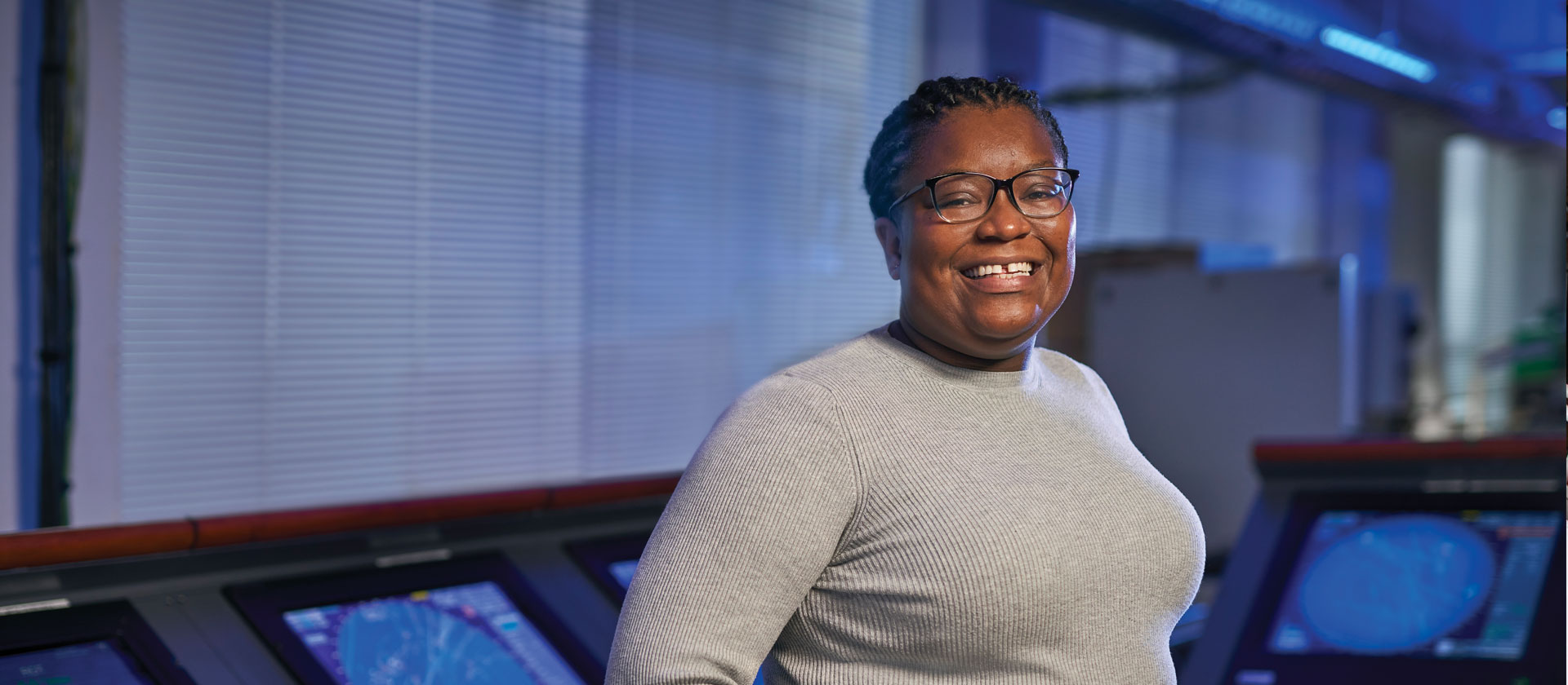 woman in computer lab smiling