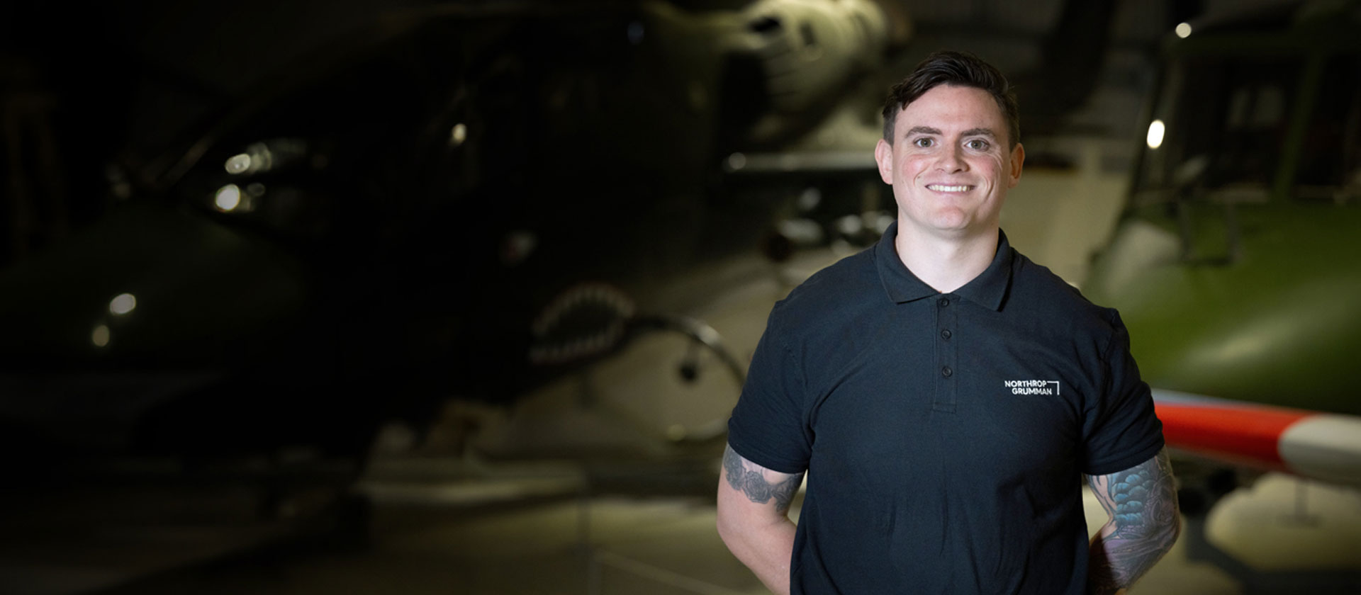 UK Veteran standing at ease with Northrop Grumman shirt