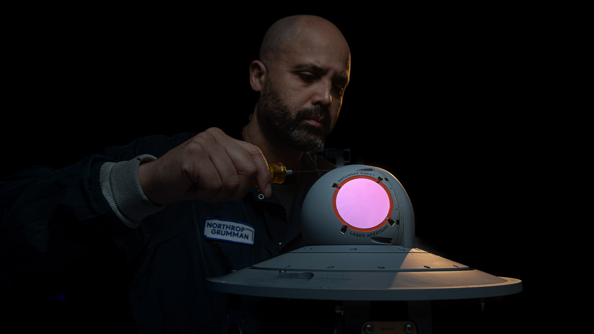 man working on product in northrop grumman outfit