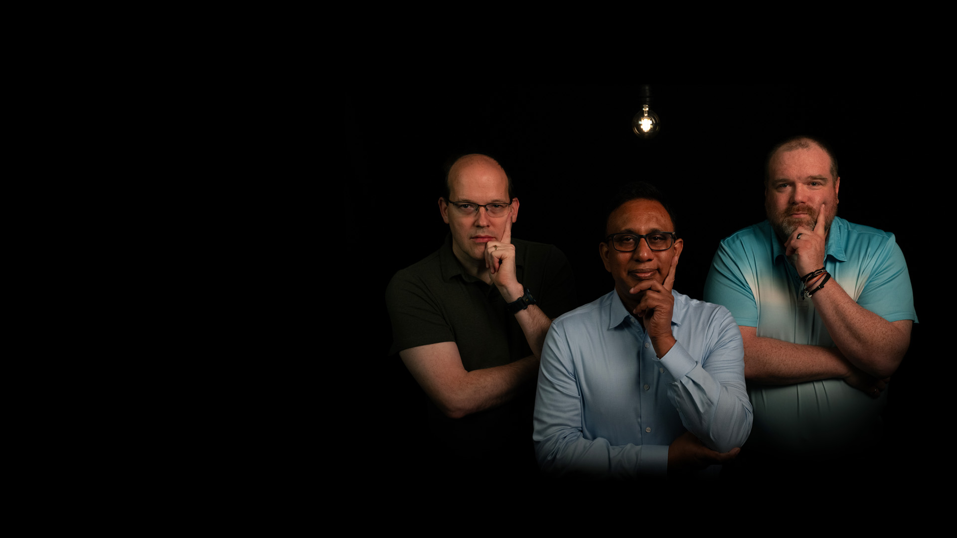 photo of a group of three men in thinking poses
