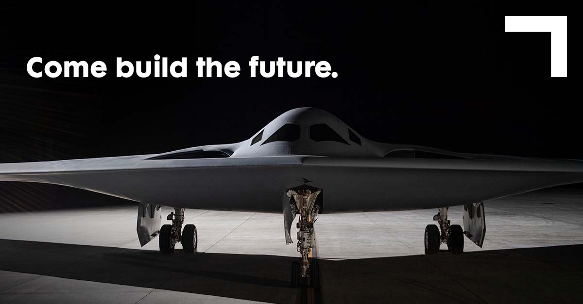 1200×627-InFeed2-ComeBuildTheFuture front view of a bomber on the ground