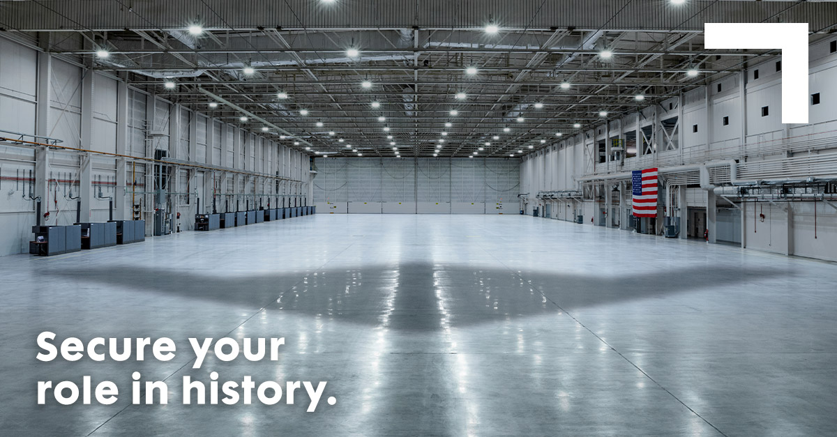 1200×627-Secure-Your-Role-In-History shadow of bomber on floor of a hanger