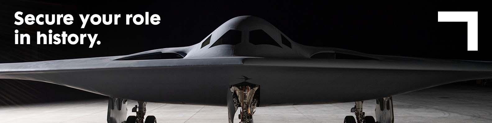 1584×396-Headers-SecureYourRoleInHistory front view of a bomber on the ground