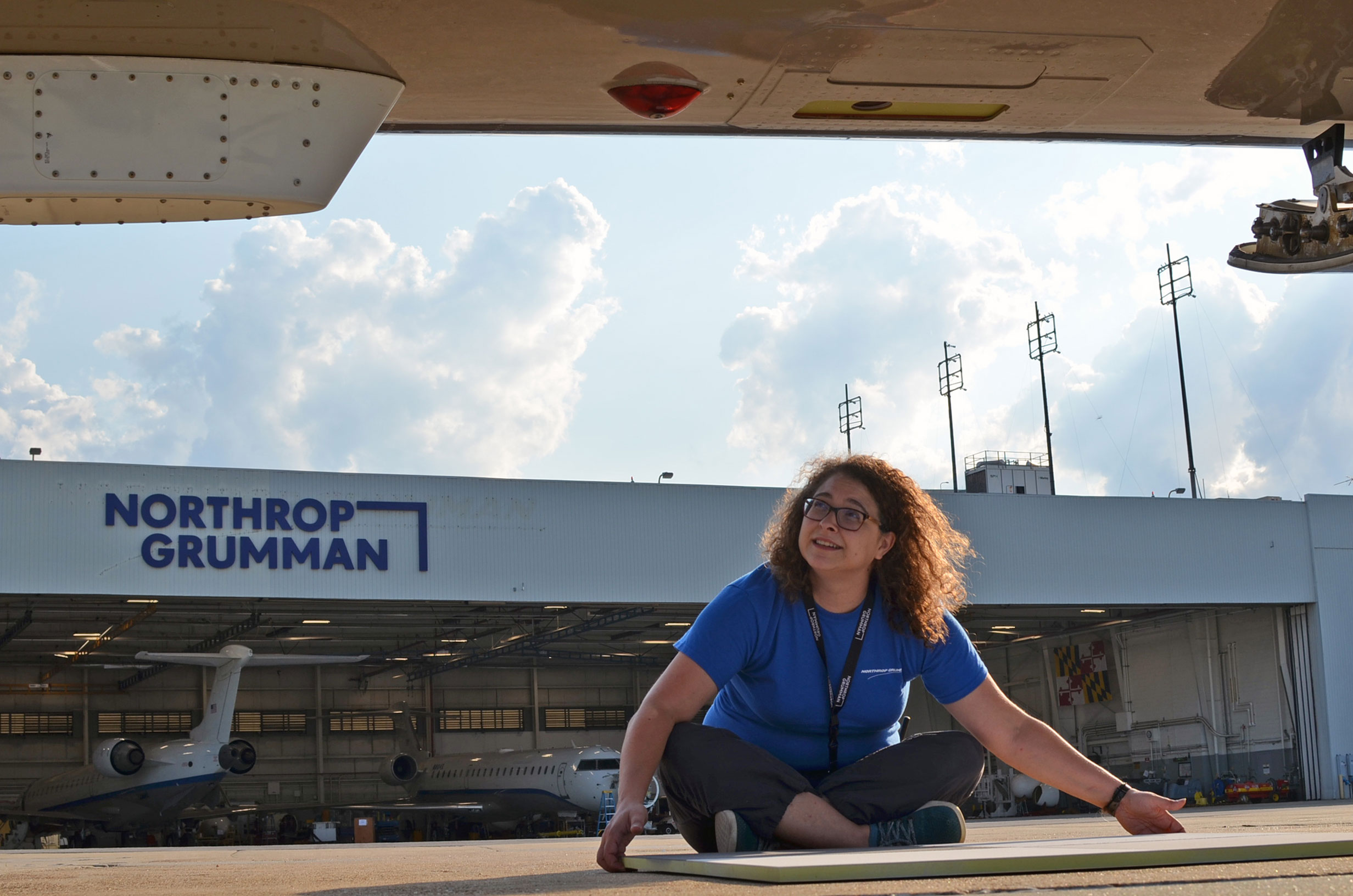 22-1378-Hero-HOP-KellyDavis- Woman calibrates equipment outside