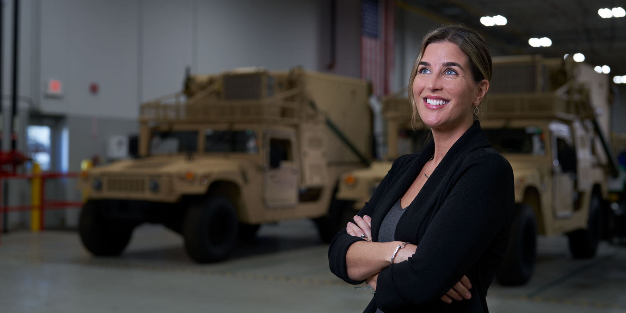 22-2001-Stephanie-Vost-Hero Woman in facility with tank smiling.