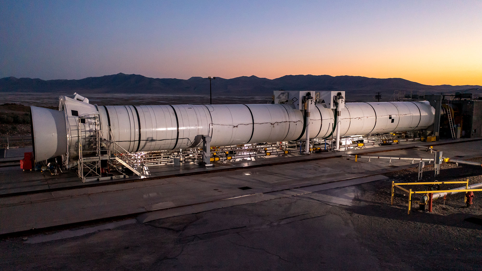 rocket laying flat on test site at sunset