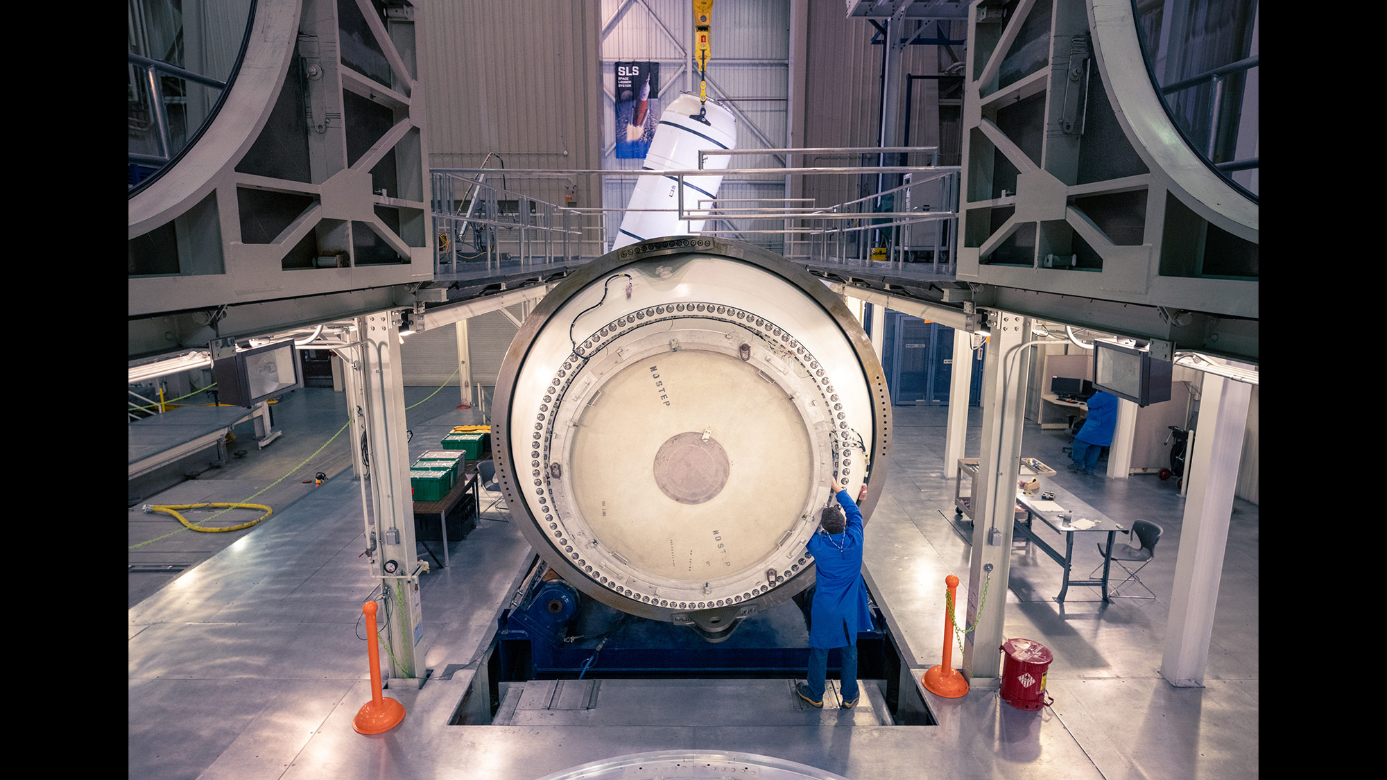 Artemis I Space Launch System rocket – slide man working on rocket