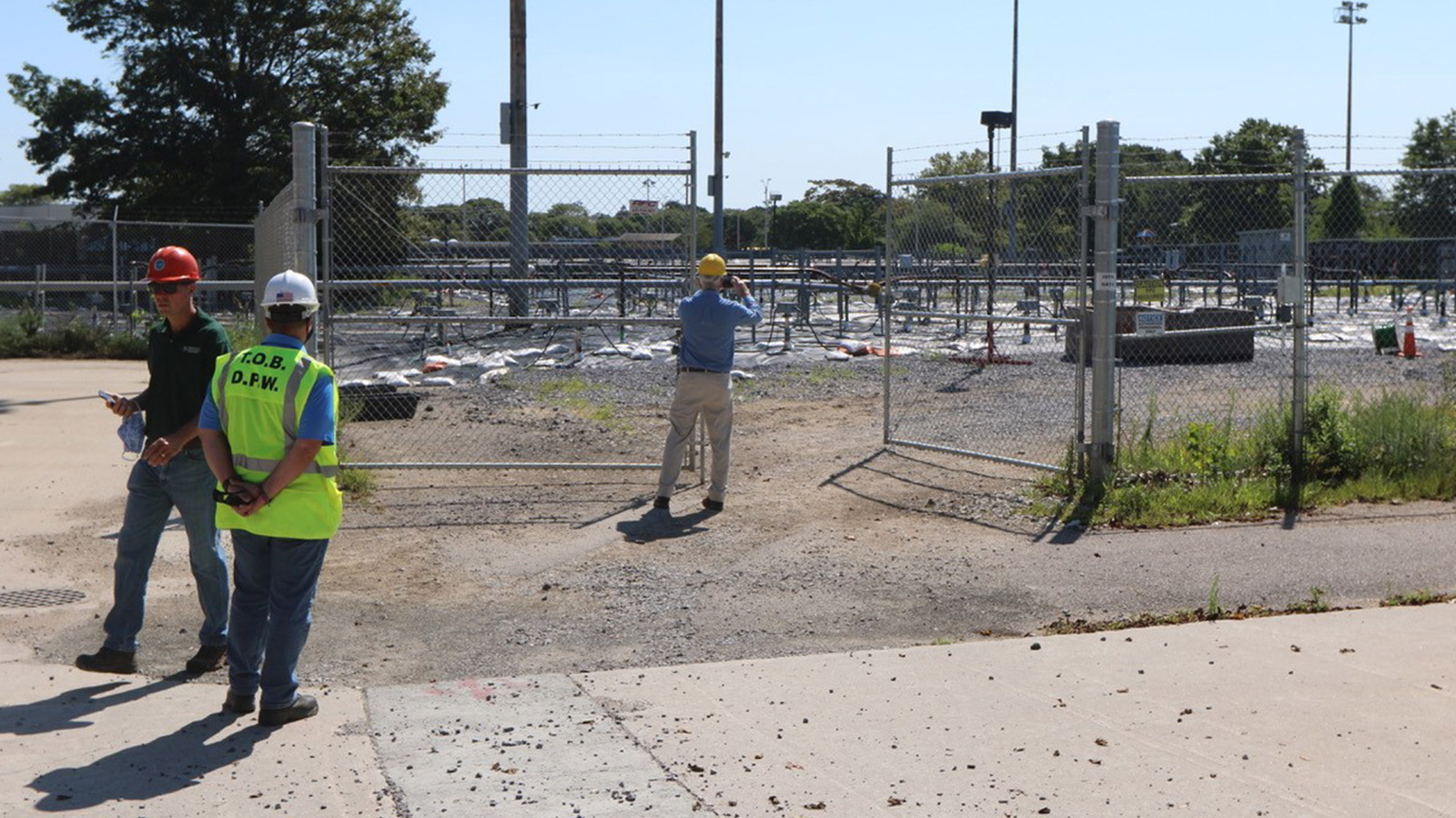 Bethpage Community Park Soil Cleanup three men in hardhats near gravel bed