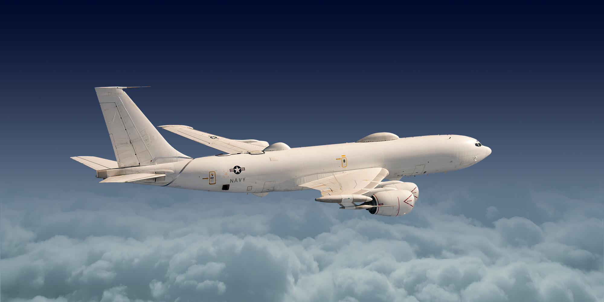 E-6B Mercury Navy plane flying above the clouds