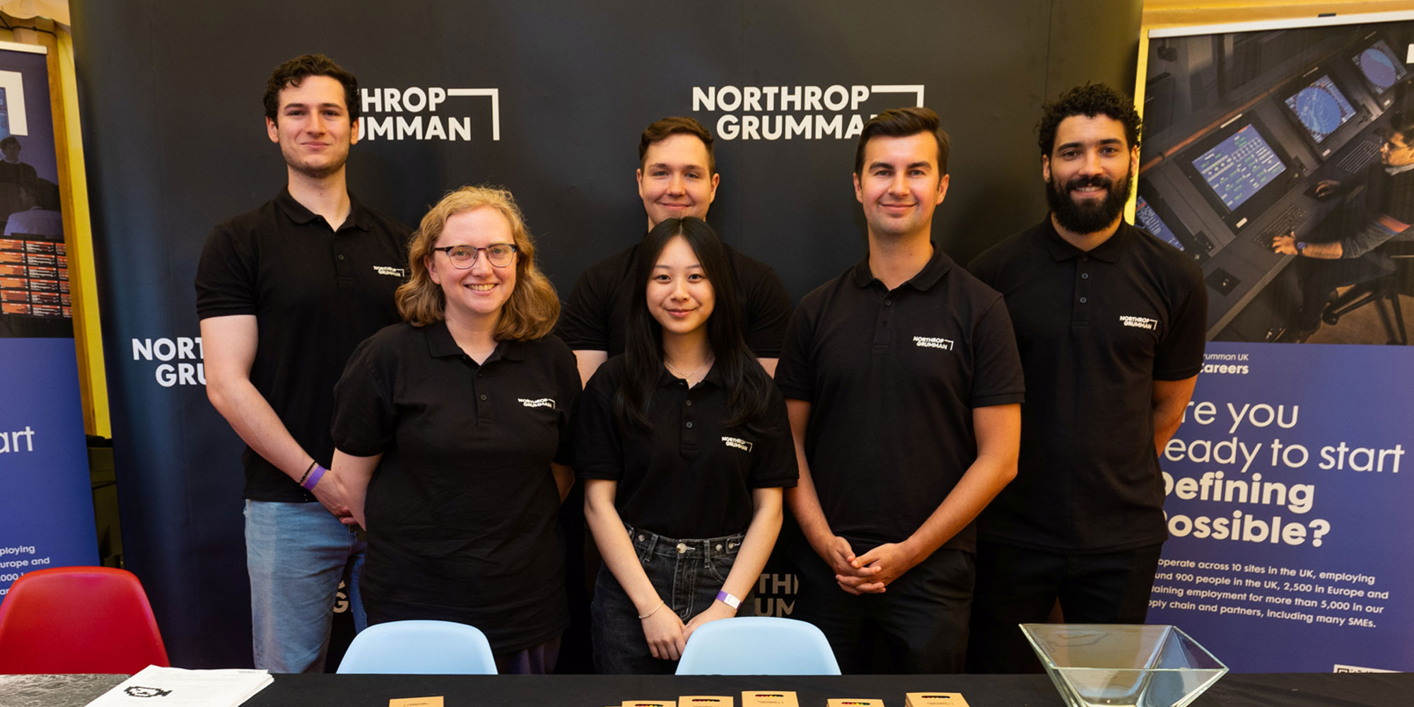 Smiling group of Northrop Grumman Employees at Recruitment Fair 