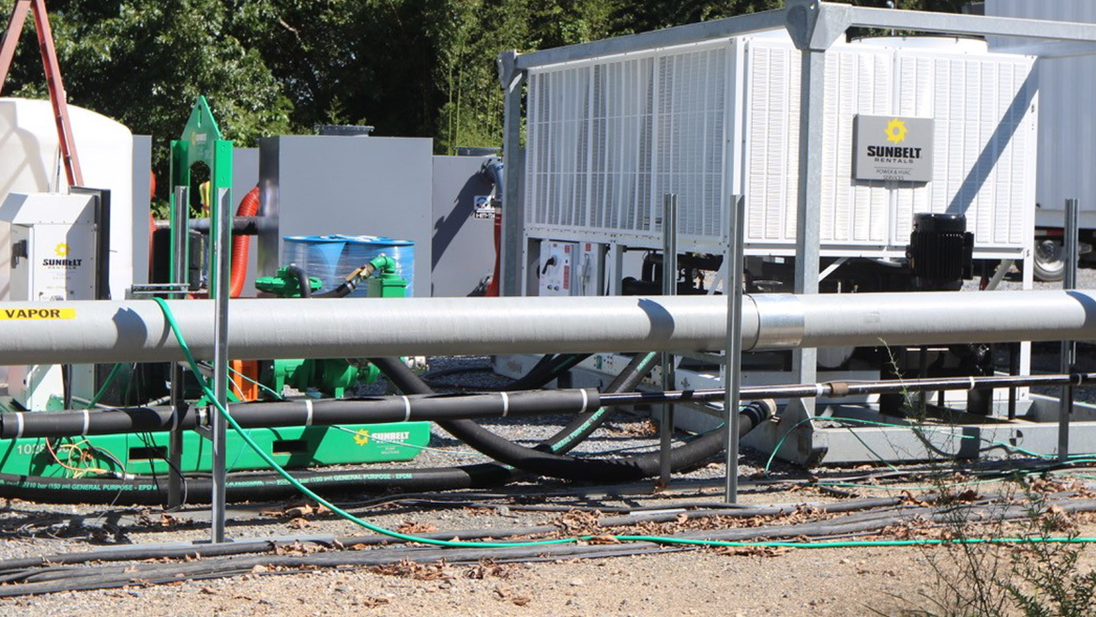 grey pipe running above ground