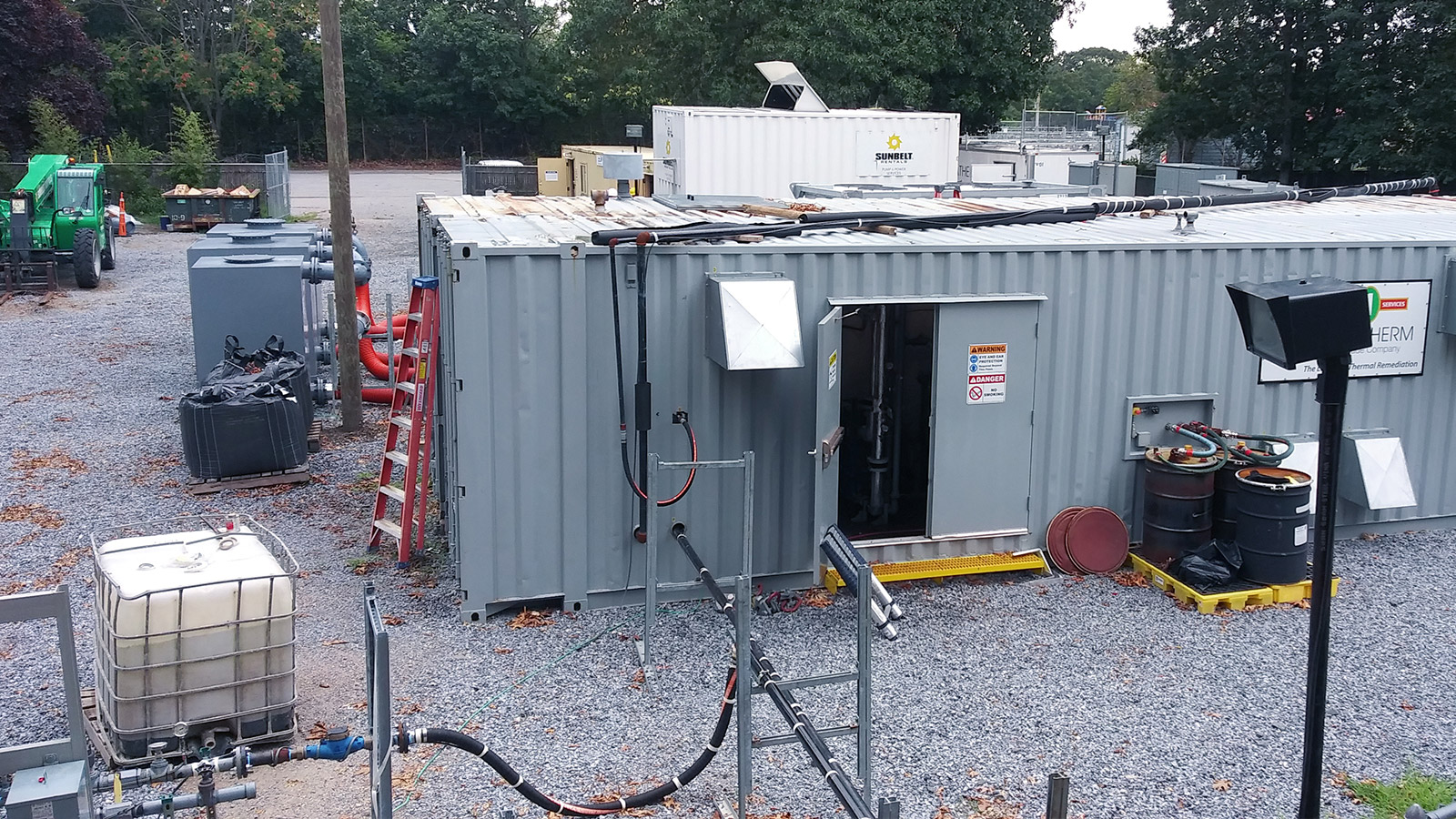 Bethpage Soil Cleanup Work Zone grey trailer on gravel bed