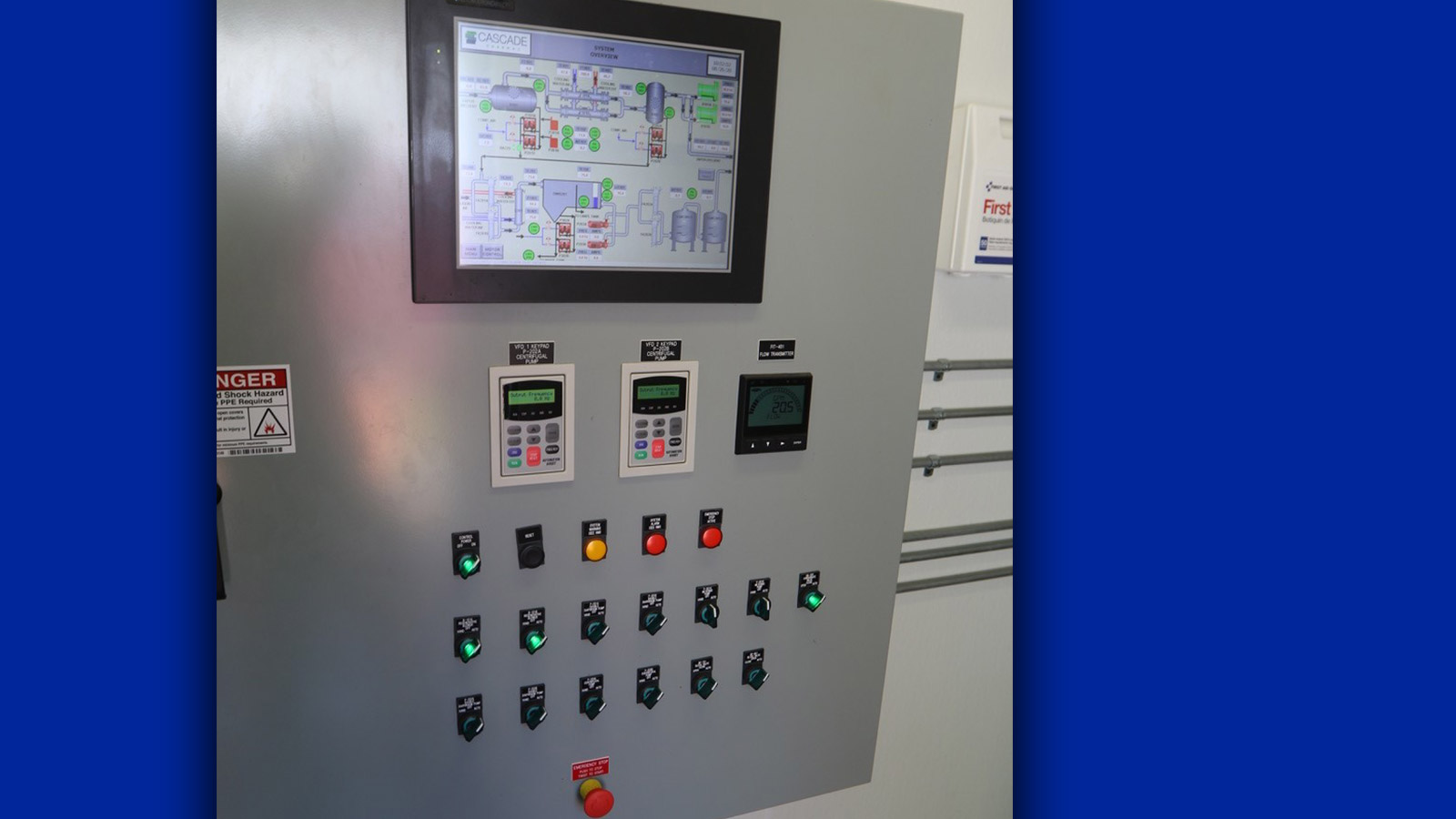 grey control panel with lights and monitor